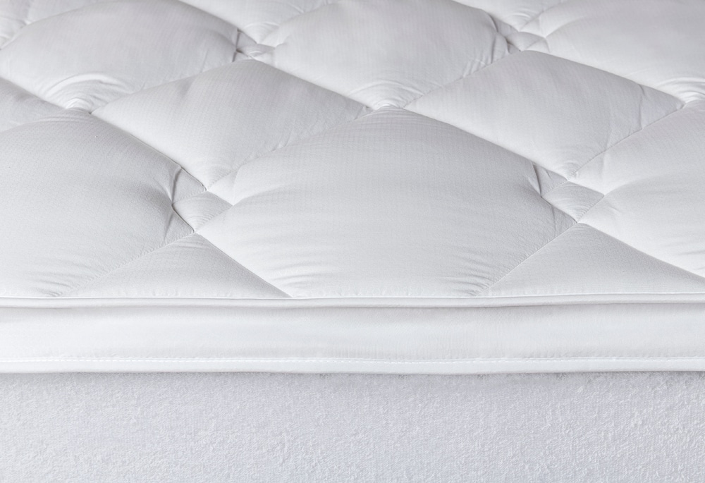 Velfont Topper Extra Confort, primer plano del doble acolchado y el ribete