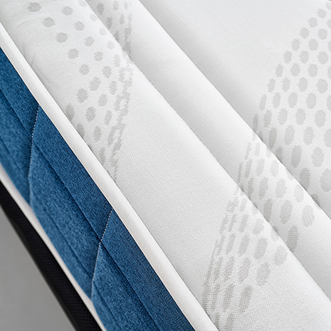 MaxColchón Naturfresh, primer plano del tejido superior blanco y el lateral azul